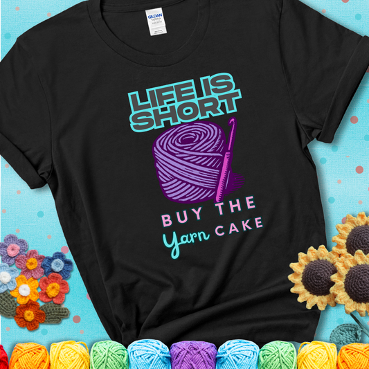 No regrets, just yarn. Design reads 'Life Is Short. Buy The Yarn (Cake)' , perfect crochet gift for yarn lovers, showing a black tee with a teal sunflower background