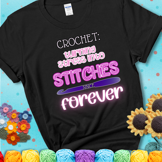 When life gets tangled, we stitch it out Design reads 'Crochet: Turning Stress Into Stitches Since Forever' , perfect crochet gift for yarn lovers; showing a black tee with a teal sunflower background