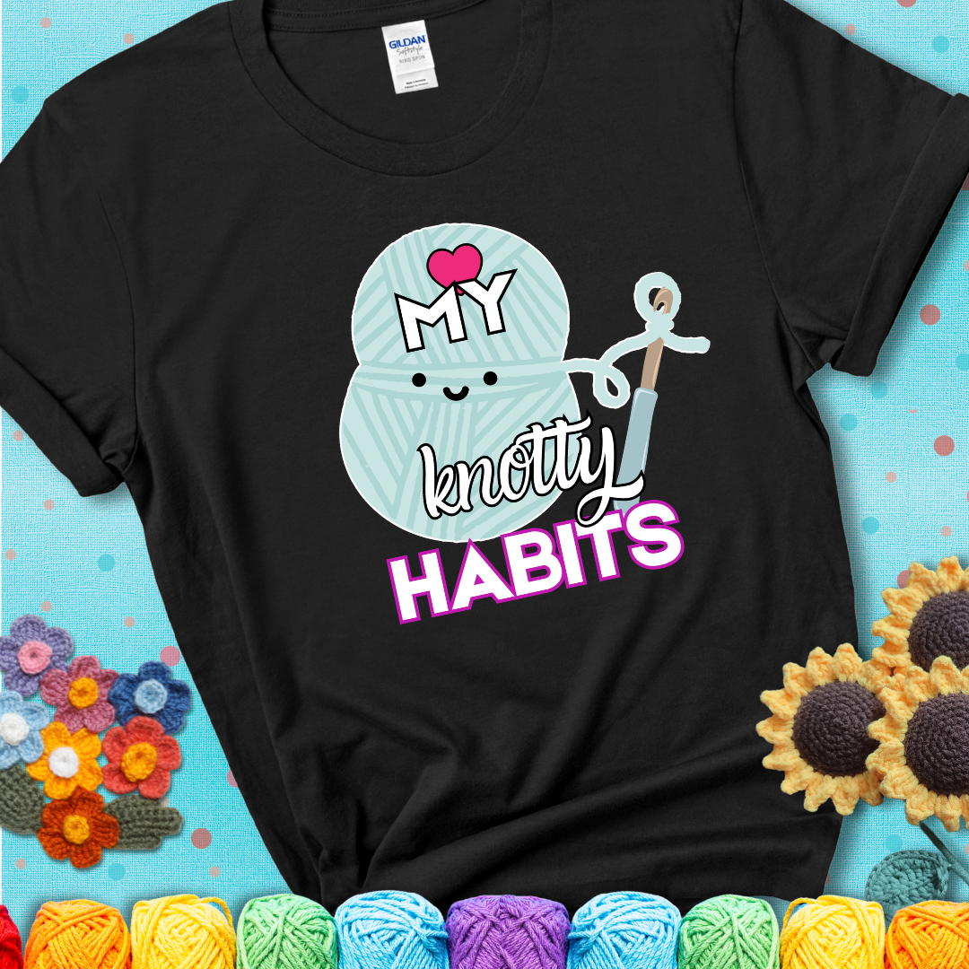 Smiling yarn ball and hook with text “Love My Knotty Habits” - cute crochet shirt with playful design for makers, showing a black tee with a teal sunflower background