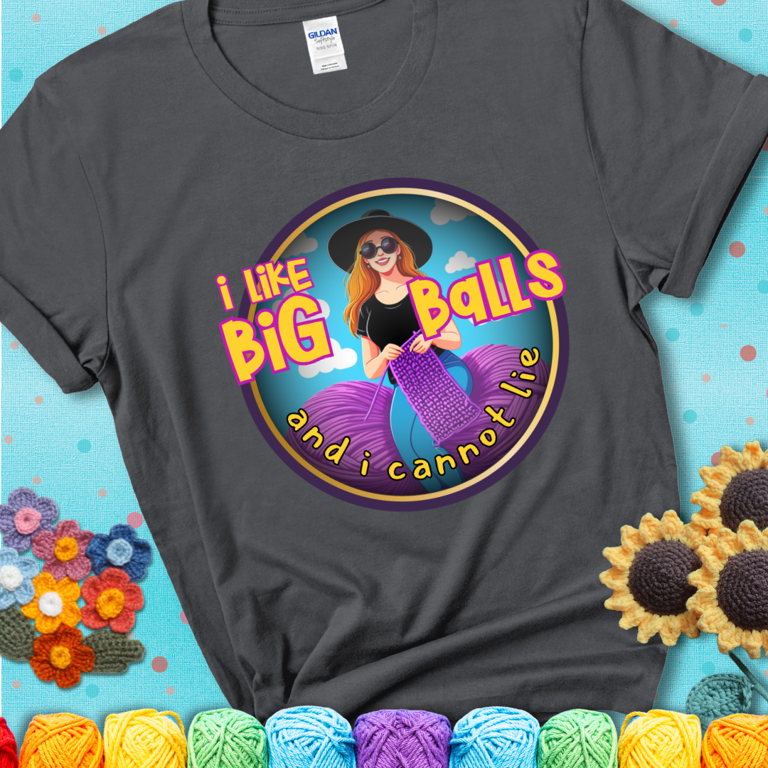 Bold cartoon image of a woman crocheting between two giant purple yarn balls with the phrase “I like big balls and I cannot lie” in retro fonts showing a charcoal grey tee with a teal sunflower background