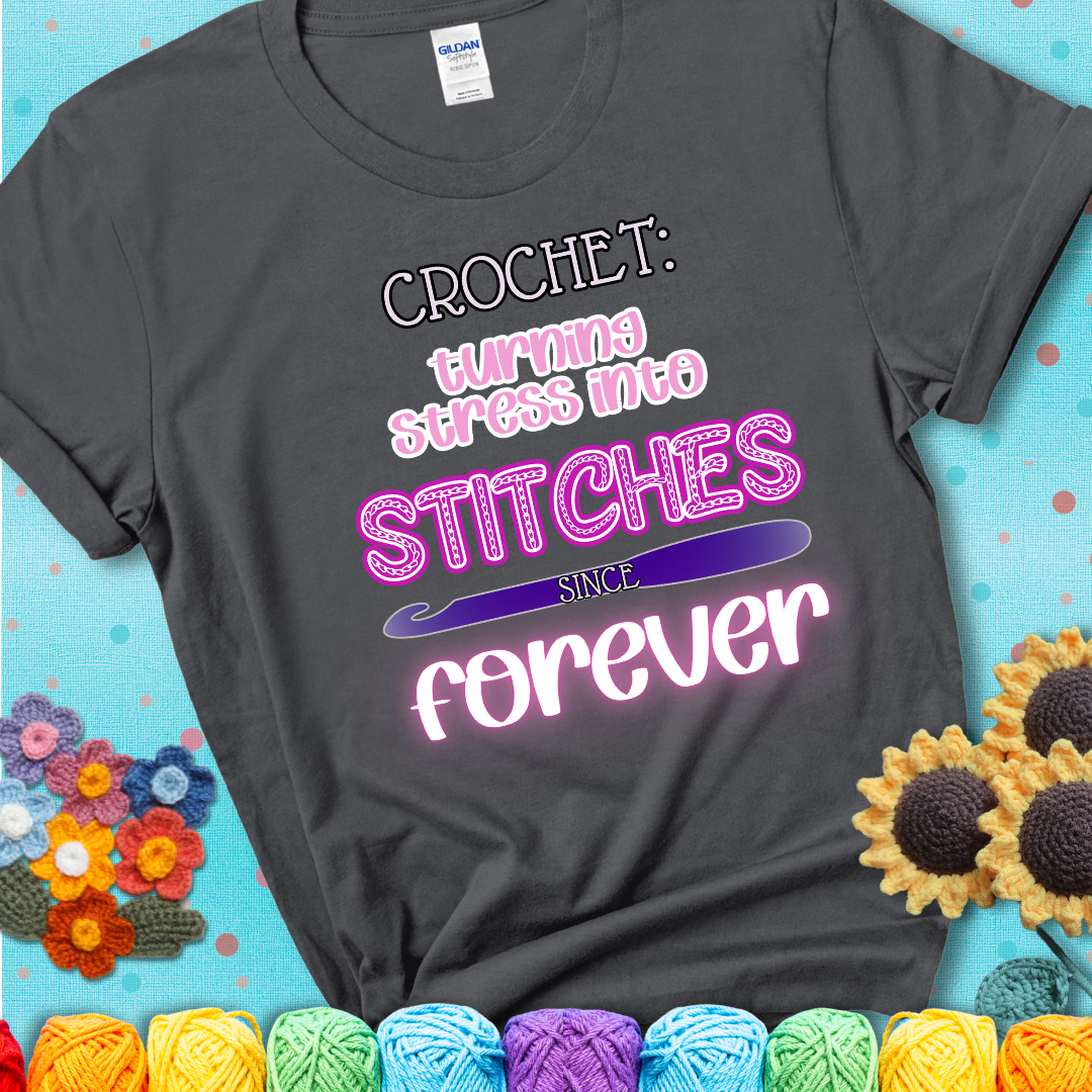 When life gets tangled, we stitch it out Design reads 'Crochet: Turning Stress Into Stitches Since Forever' , perfect crochet gift for yarn lovers; showing a charcoal grey tee with a teal sunflower background