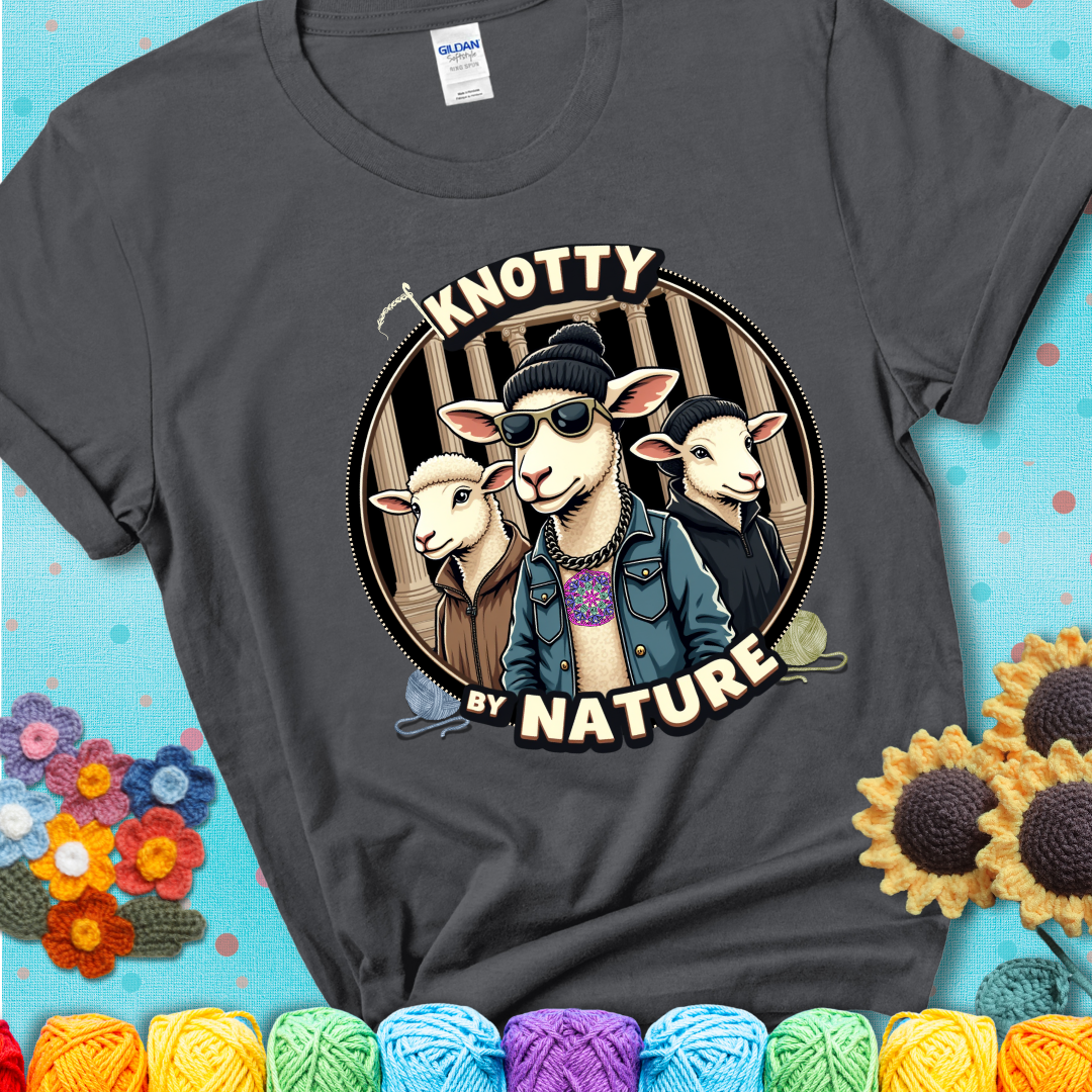 Three cool sheep dressed in urban streetwear pose in front of columns, with bold text “Knotty By Nature” on a charcoal grey tee, a hilarious crochet parody with swagger.