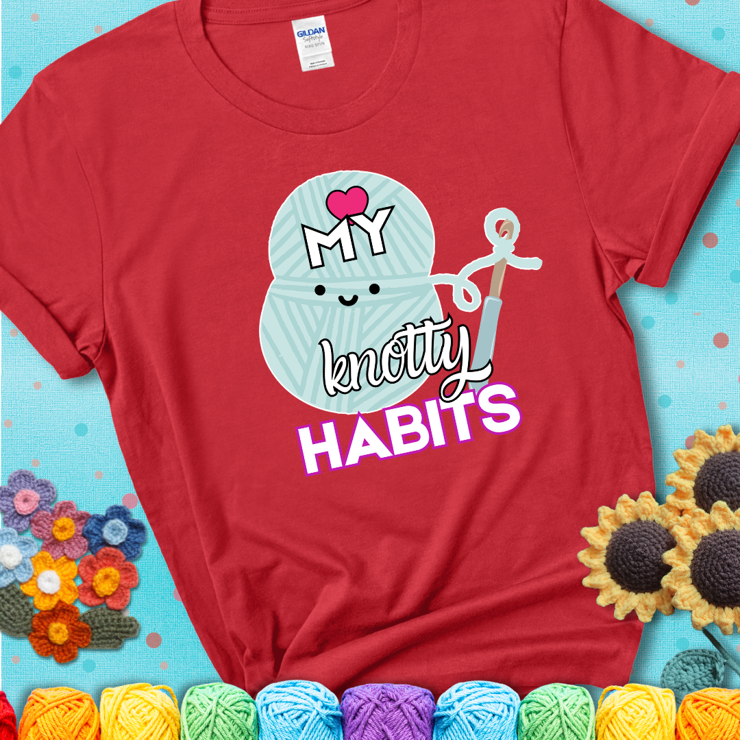 Smiling yarn ball and hook with text “Love My Knotty Habits” - cute crochet shirt with playful design for makers, showing a red tee with a teal sunflower background
