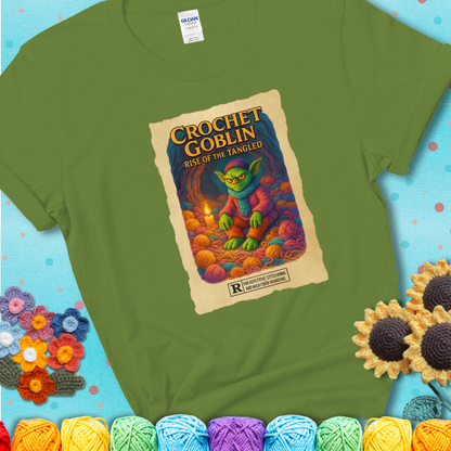 Crochet goblin surrounded by chaotic yarn stash in a cave-like lair. Text reads: “Crochet Goblin: Rise of the Tangled.” A funny fantasy-style green tee for yarn hoarders and goblin-mode crafters.