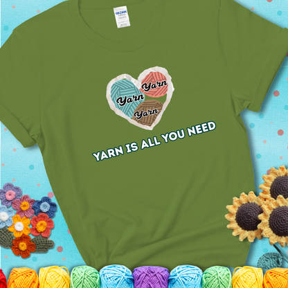 Kiwi t-shirt with a colorful heart made of yarn textures and the phrase “Yarn Is All You Need” in retro lettering.