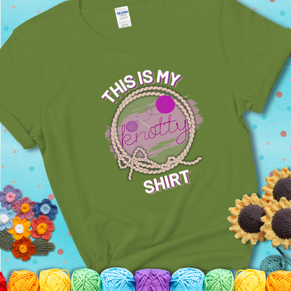 Kiwi t-shirt with the phrase “This is My Knotty Shirt” inside a rope circle, featuring a yarn ball and crochet hook forming the word “knotty.”
