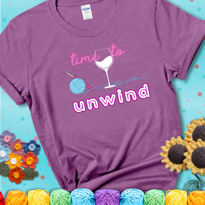 Wine down with your yarn out Design reads 'Time To Unwind' , perfect crochet gift for yarn lovers showing a lavender tee with a teal sunflower background