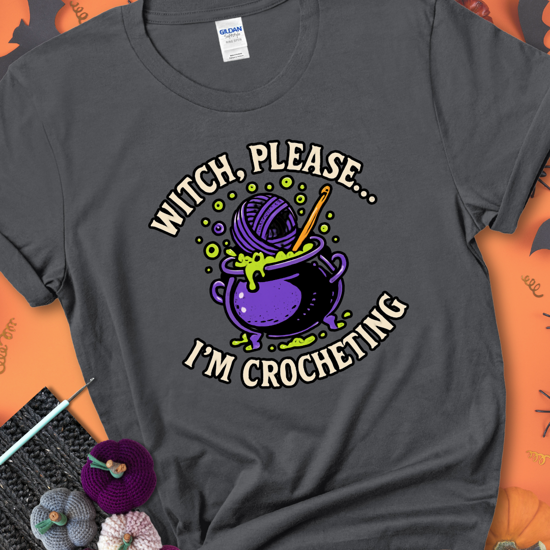 Charcoal “Witch, Please… I’m Crocheting” Halloween crochet shirt with purple cauldron, yarn, and crochet hook