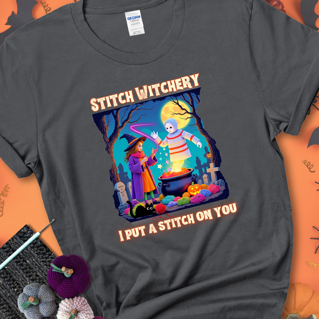 Charcoal t-shirt with a yarn witch casting a spell from a cauldron onto a floating crochet ghost, with text “Stitch Witchery” and “I Put a Stitch on You.”