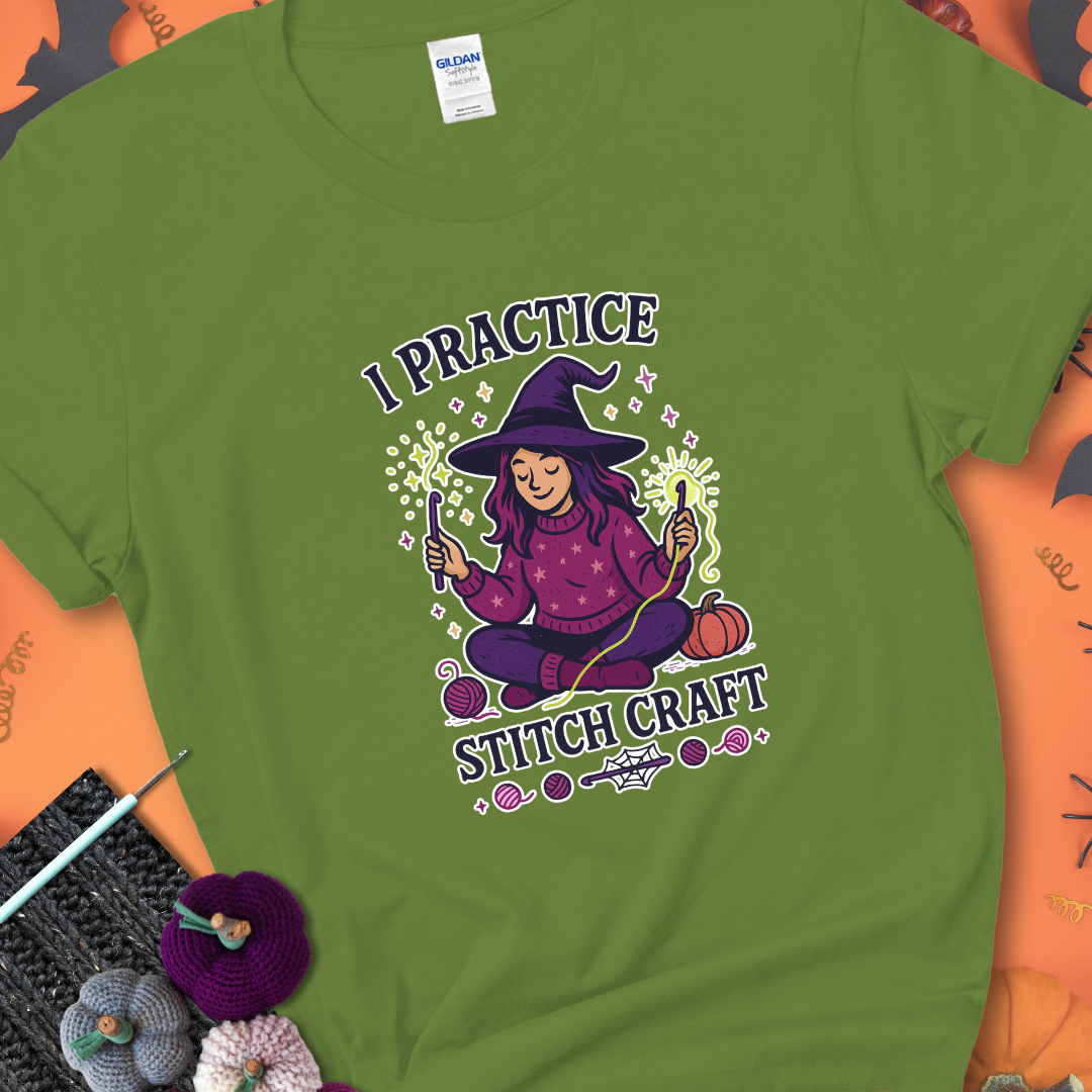 Kiwi t-shirt with a witchy crocheter conjuring glowing yarn with crochet hooks, surrounded by stars and pumpkins, with the phrase “I Practice Stitch Craft.”