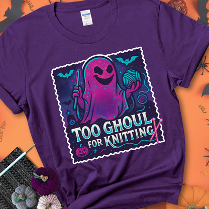 Purple t-shirt with a ghost holding a crochet hook and ball of yarn, with the phrase “Too Ghoul for Knitting” in purple, teal, and white.