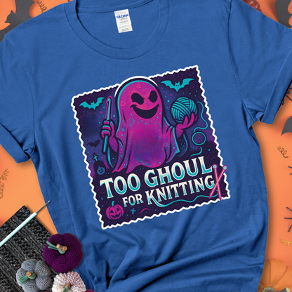 Royal t-shirt with a ghost holding a crochet hook and ball of yarn, with the phrase “Too Ghoul for Knitting” in purple, teal, and white.
