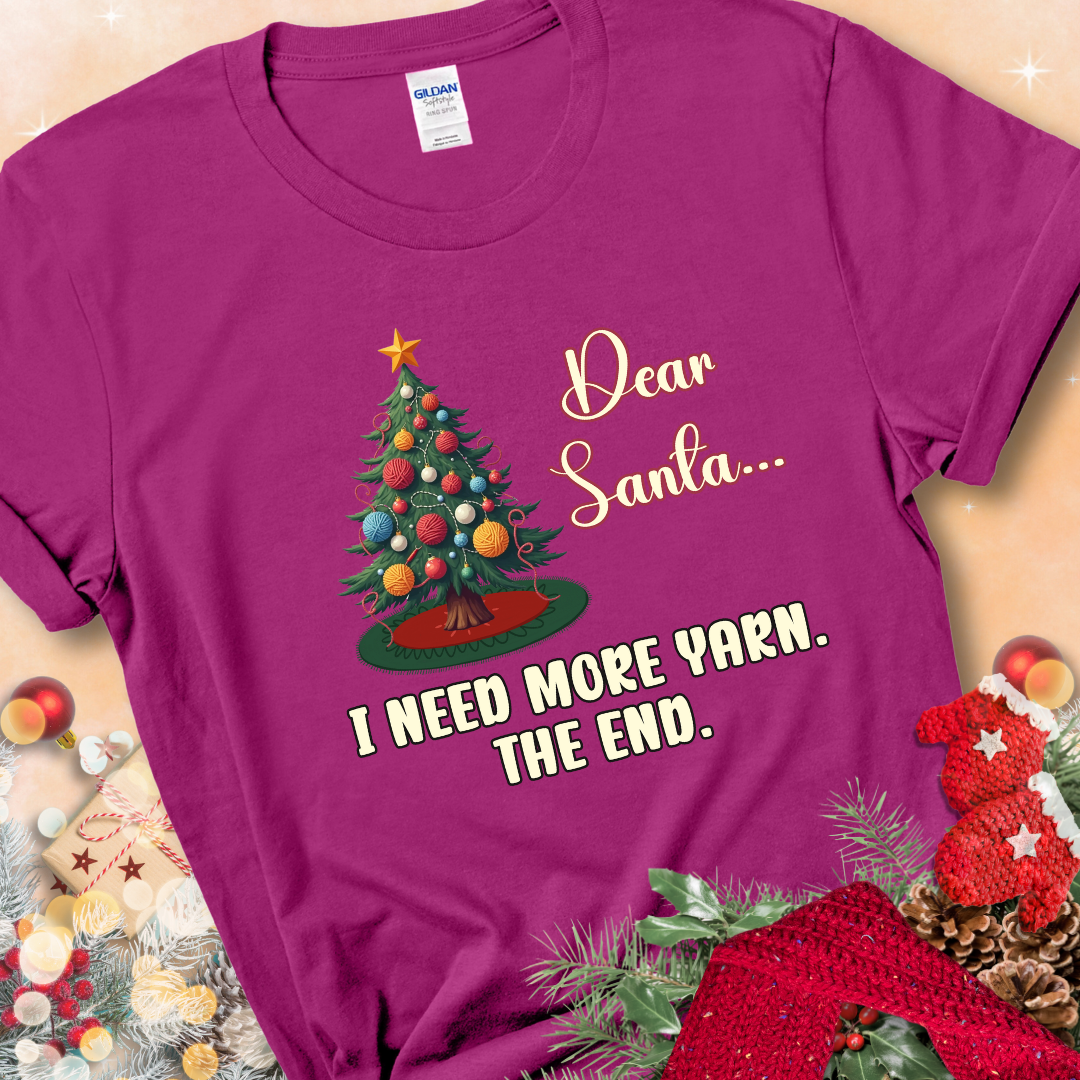 Antique Heliconia t-shirt with a Christmas tree decorated with yarn-ball ornaments and the stitched message “Dear Santa… I Need More Yarn. The End.”