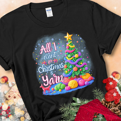 Black t-shirt with a colorful Christmas tree decorated with yarn and the phrase “All I Want For Christmas Is Yarn.”