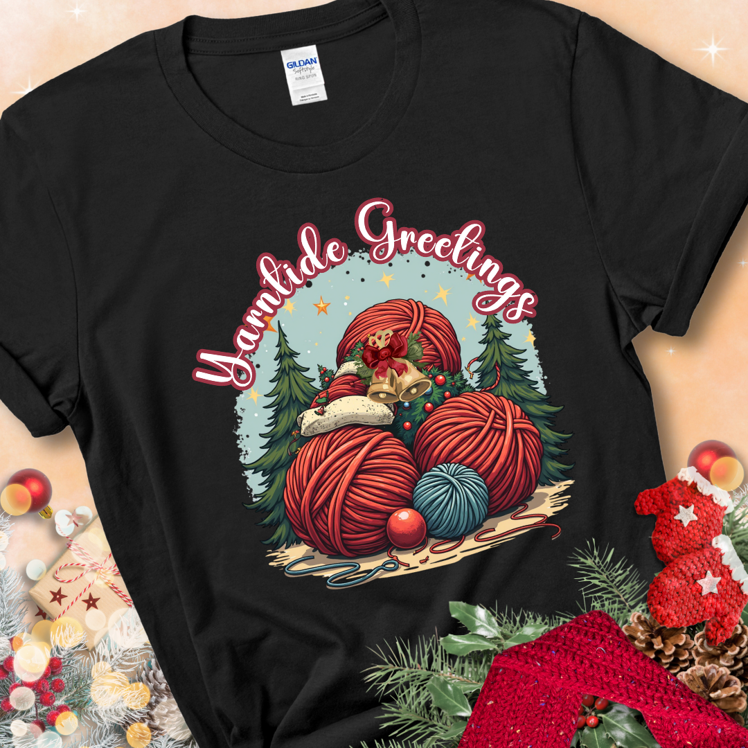 Black t-shirt with red yarn balls, holiday greenery, bells, and the phrase “Yarntide Greetings.”