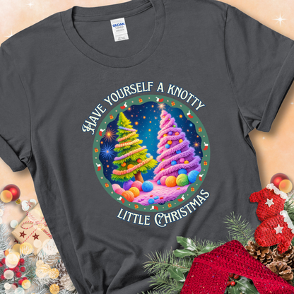 Charcoal t-shirt with two yarn-covered Christmas trees wrapped in colorful strands of yarn, encircled by the phrase “Have Yourself A Knotty Little Christmas.”