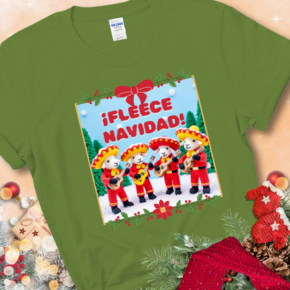 Kiwi t-shirt with four crocheted sheep in red mariachi outfits holding guitars, standing in a snowy scene under the phrase “¡Fleece Navidad!”