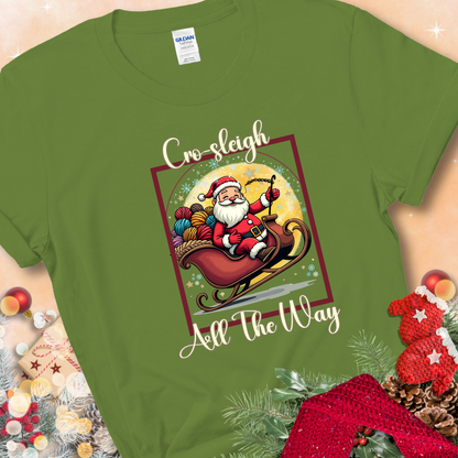 Kiwi t-shirt with Santa riding in a sleigh overflowing with colorful yarn and the phrase “Cro-Sleigh All The Way.”