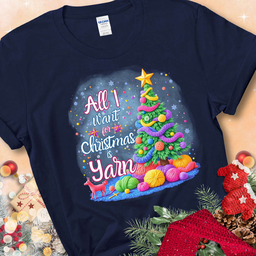 Navy t-shirt with a colorful Christmas tree decorated with yarn and the phrase “All I Want For Christmas Is Yarn.”