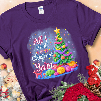 Purple t-shirt with a colorful Christmas tree decorated with yarn and the phrase “All I Want For Christmas Is Yarn.”