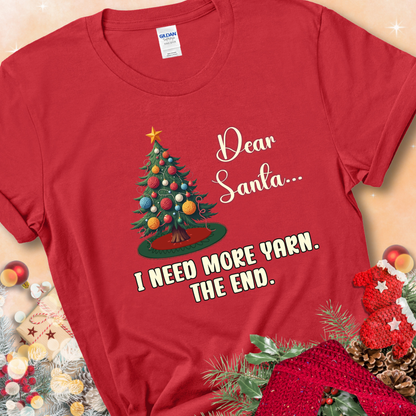 Red t-shirt with a Christmas tree decorated with yarn-ball ornaments and the stitched message “Dear Santa… I Need More Yarn. The End.”