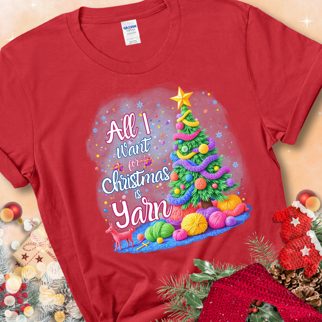 Red t-shirt with a colorful Christmas tree decorated with yarn and the phrase “All I Want For Christmas Is Yarn.”