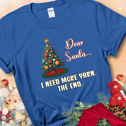 Royal t-shirt with a Christmas tree decorated with yarn-ball ornaments and the stitched message “Dear Santa… I Need More Yarn. The End.”