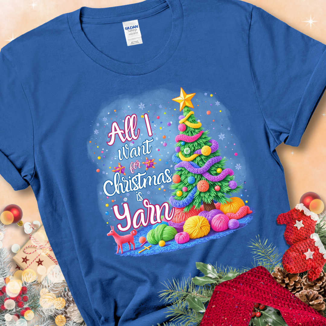 Royal Blue t-shirt with a colorful Christmas tree decorated with yarn and the phrase “All I Want For Christmas Is Yarn.”