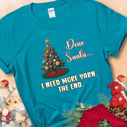 Tropical Blue t-shirt with a Christmas tree decorated with yarn-ball ornaments and the stitched message “Dear Santa… I Need More Yarn. The End.”