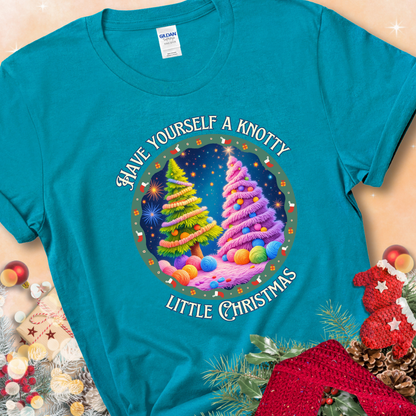 Tropical Blue t-shirt with two yarn-covered Christmas trees wrapped in colorful strands of yarn, encircled by the phrase “Have Yourself A Knotty Little Christmas.”