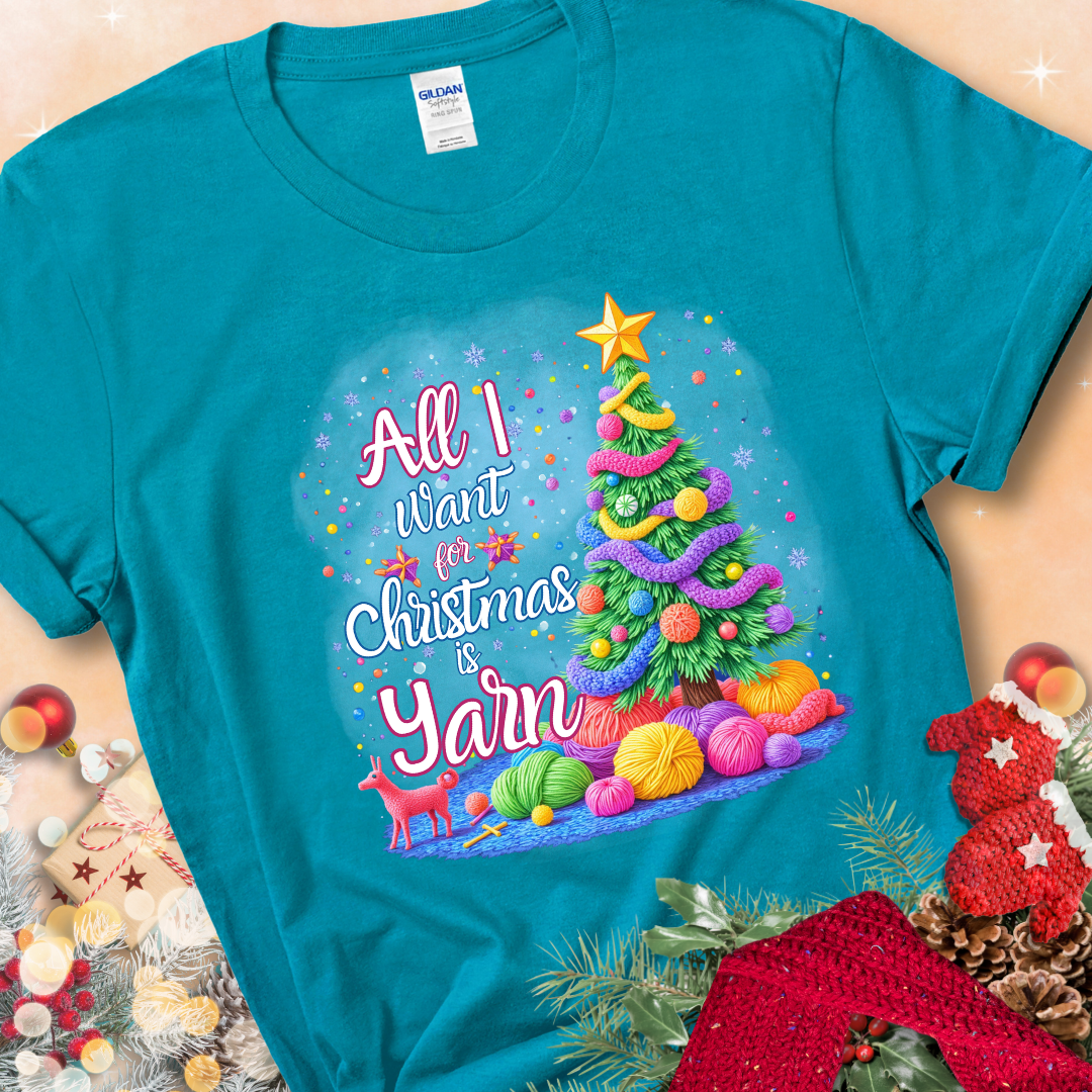 Tropical Blue t-shirt with a colorful Christmas tree decorated with yarn and the phrase “All I Want For Christmas Is Yarn.”