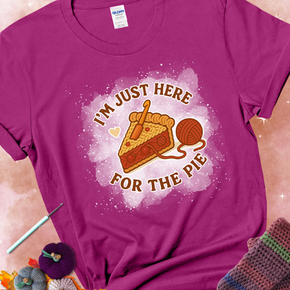 Antique Heliconia t-shirt with a stitched slice of cherry pie with yarn-inspired filling and the phrase “I’m Just Here for the Pie” in red, beige, and cream.