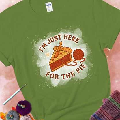 Kiwi t-shirt with a stitched slice of cherry pie with yarn-inspired filling and the phrase “I’m Just Here for the Pie” in red, beige, and cream.