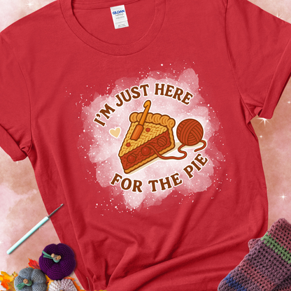 Red t-shirt with a stitched slice of cherry pie with yarn-inspired filling and the phrase “I’m Just Here for the Pie” in red, beige, and cream.