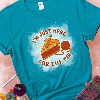 Tropical Blue t-shirt with a stitched slice of cherry pie with yarn-inspired filling and the phrase “I’m Just Here for the Pie” in red, beige, and cream.
