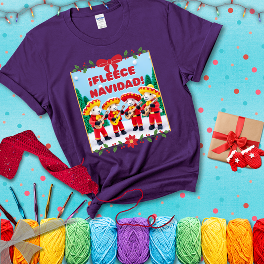 Four crocheted sheep dressed in red mariachi outfits with guitars, standing in a snowy scene under the phrase “¡Fleece Navidad!” showing a purple tee with a festive Christmas background