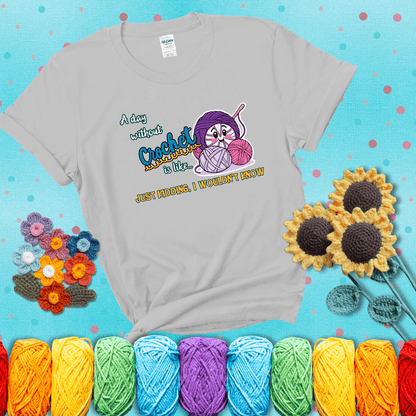 Cartoon ball of yarn character with happy face surrounded by more yarn and a hook, next to playful text about never skipping crochet, wearing a light grey tee with a teal sunflower background