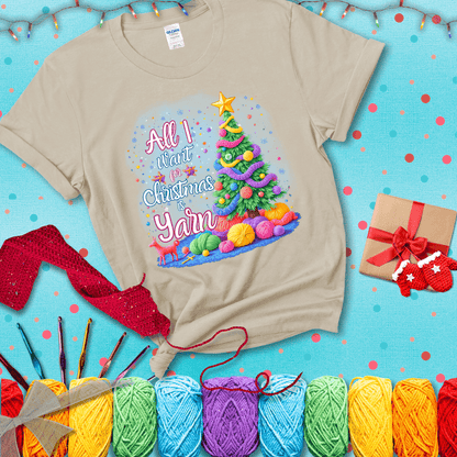 Bright Christmas tree decorated with yarn garlands, balls of yarn underneath, and the text “All I Want for Christmas is Yarn” in festive fonts, showing a beige tee with a festive Christmas background