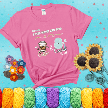 Design reads “My body: I need water and food. Me: Coffee & Crochet it is,” with a smiling coffee cup and yarn ball characters showing a pink tee with a teal sunflower background
