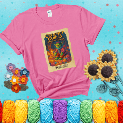 Crochet goblin surrounded by chaotic yarn stash in a cave-like lair. Text reads: “Crochet Goblin: Rise of the Tangled.” A funny fantasy-style tee for yarn hoarders and goblin-mode crafters. showing a pink tee with a teal sunflower background