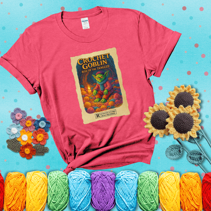 Crochet goblin surrounded by chaotic yarn stash in a cave-like lair. Text reads: “Crochet Goblin: Rise of the Tangled.” A funny fantasy-style tee for yarn hoarders and goblin-mode crafters. showing a light red tee with a teal sunflower background