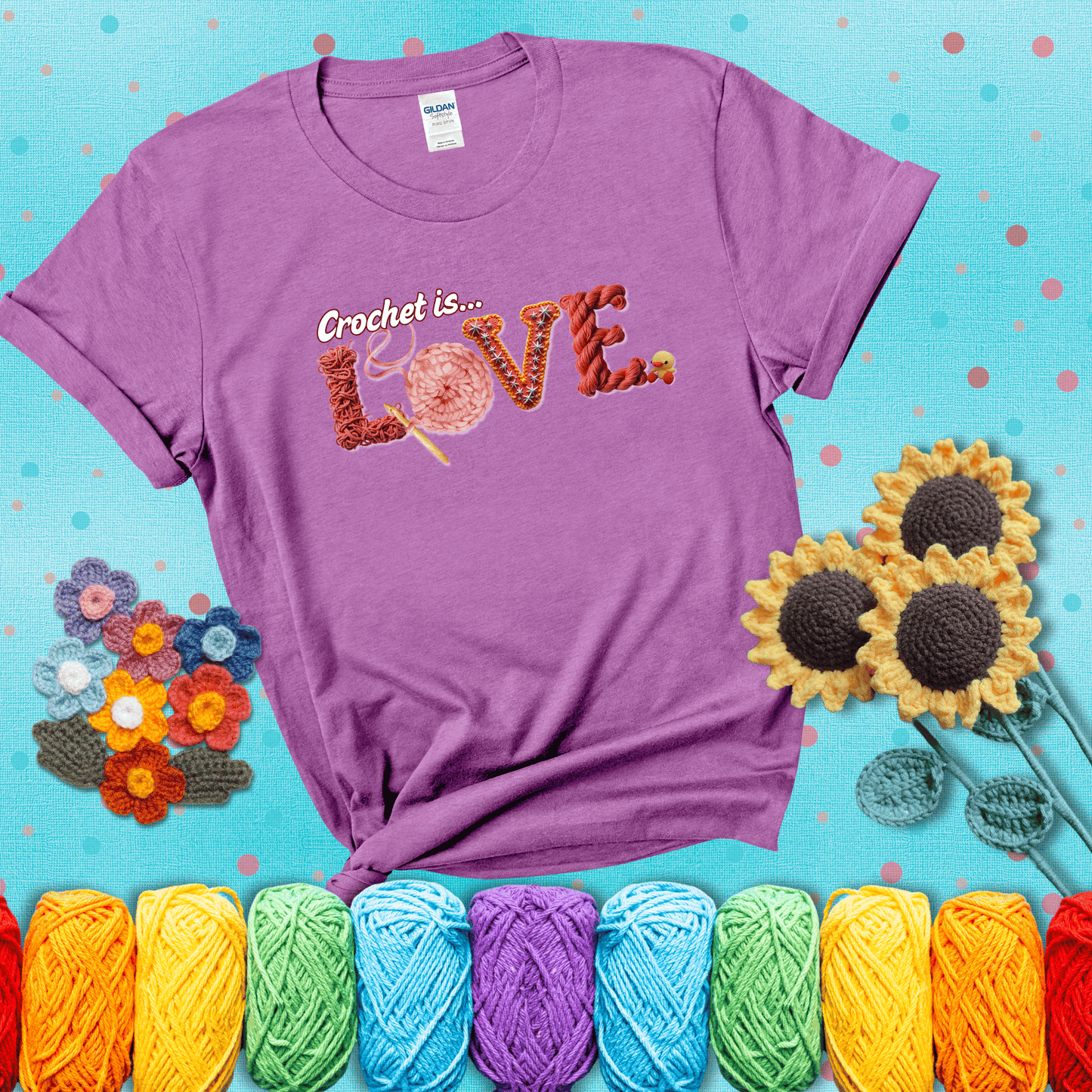 The word "LOVE" spelled with different crochet textures and yarn in red tones, with the phrase “Crochet is…” above in script. showing a blue-green tee with a teal sunflower background