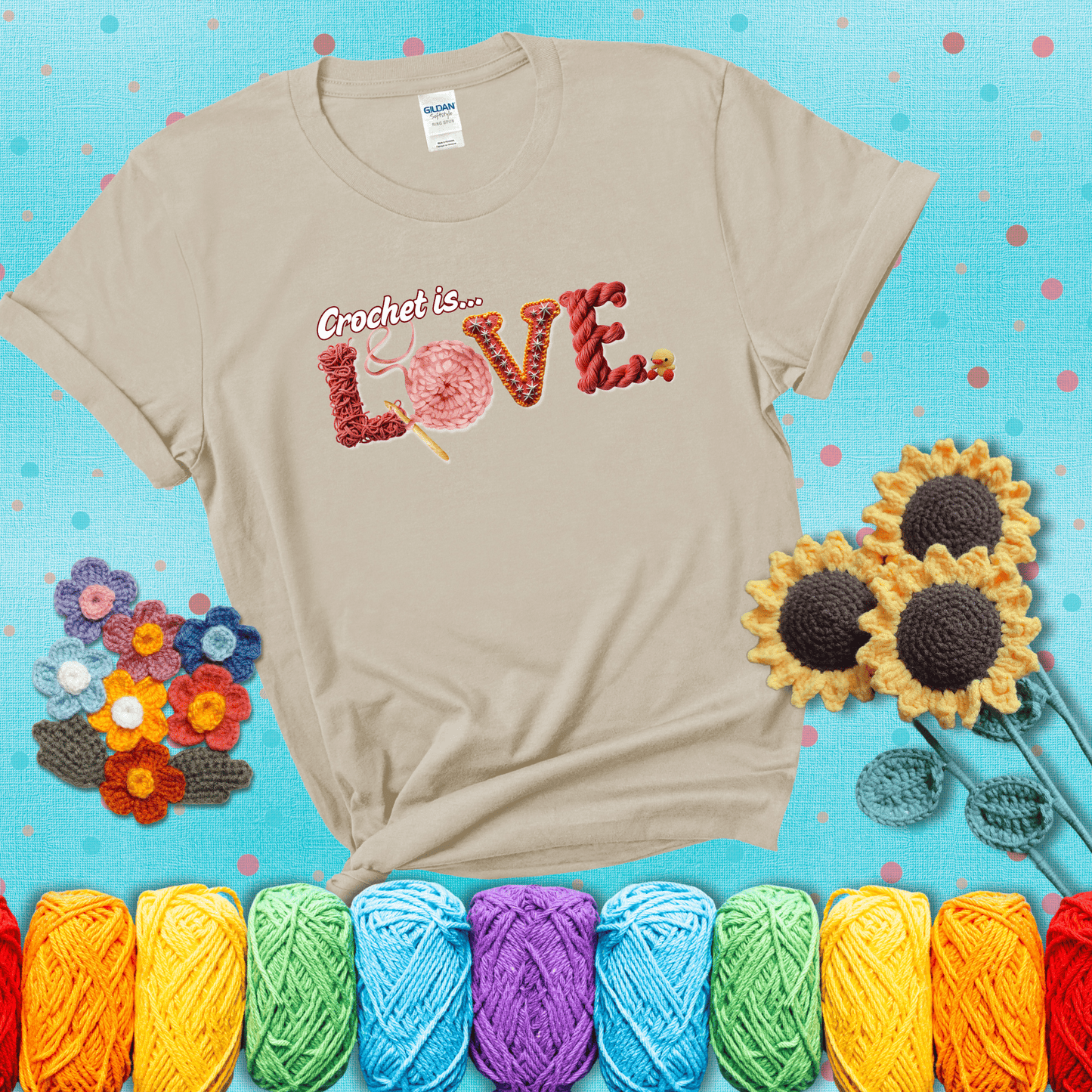 The word "LOVE" spelled with different crochet textures and yarn in red tones, with the phrase “Crochet is…” above in script. showing a dark grey tee with a teal sunflower background