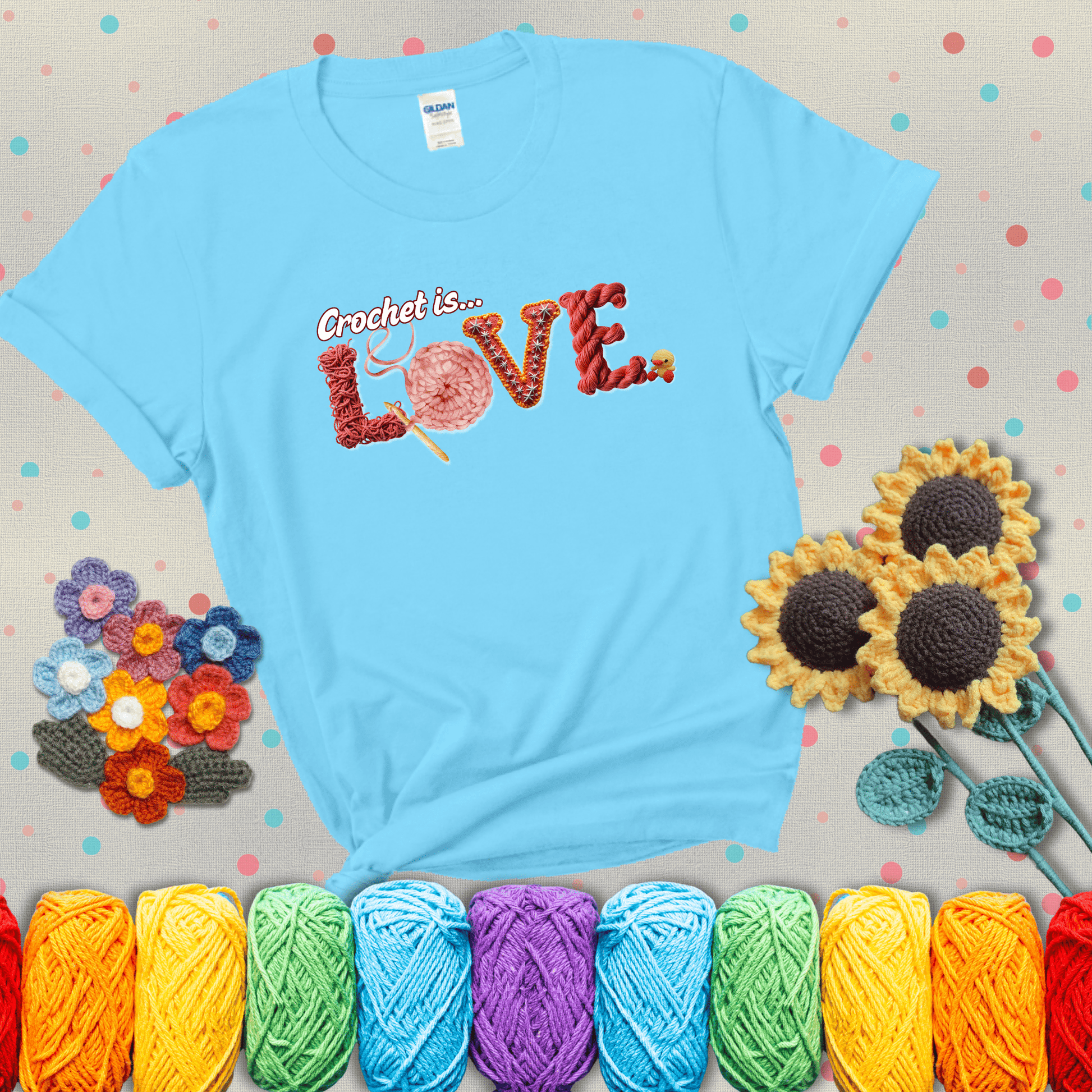 The word "LOVE" spelled with different crochet textures and yarn in red tones, with the phrase “Crochet is…” above in script. showing a light grey tee with a teal sunflower background