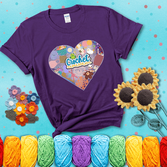 A heart filled with colorful crochet essentials including yarn, hooks, scissors, notions, and handmade items, with the word "Crochet" prominently in the center, showing a purple tee with a teal sunflower background