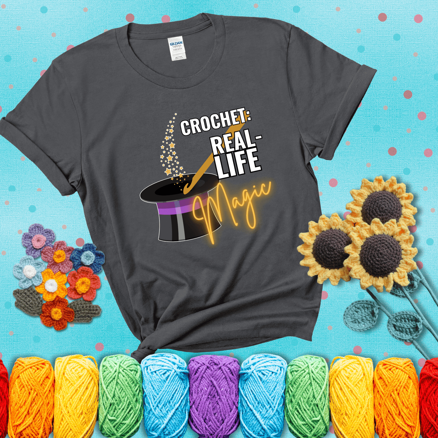 Poof! Stress gone Design reads 'Crochet: Real-Life Magic' , perfect crochet gift for yarn lovers; showing a dark grey tee with a teal sunflower background