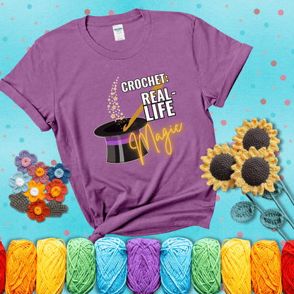 Poof! Stress gone Design reads 'Crochet: Real-Life Magic' , perfect crochet gift for yarn lovers; showing a light purple tee with a teal sunflower background