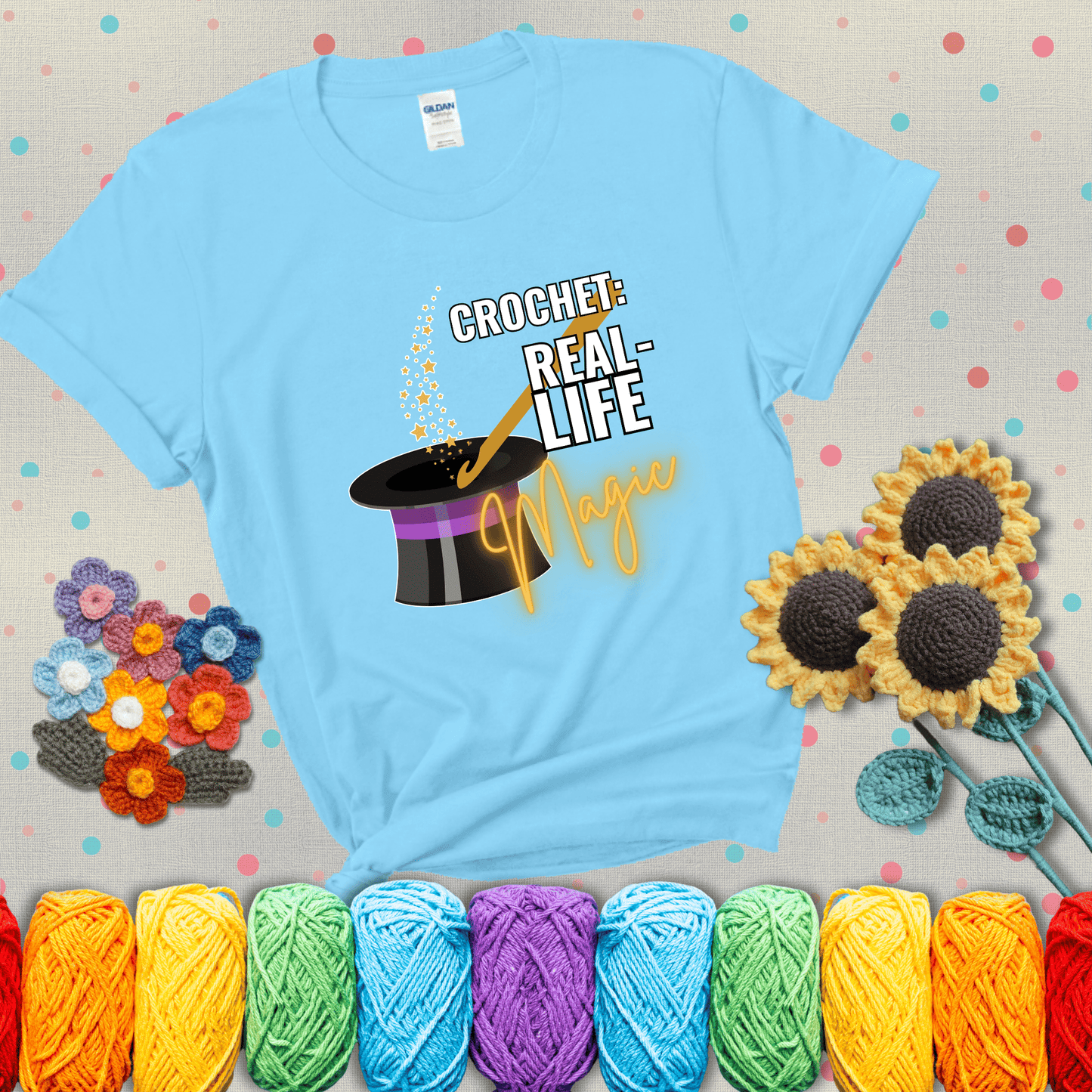 Poof! Stress gone Design reads 'Crochet: Real-Life Magic' , perfect crochet gift for yarn lovers; showing a light blue tee with grey sunflower background