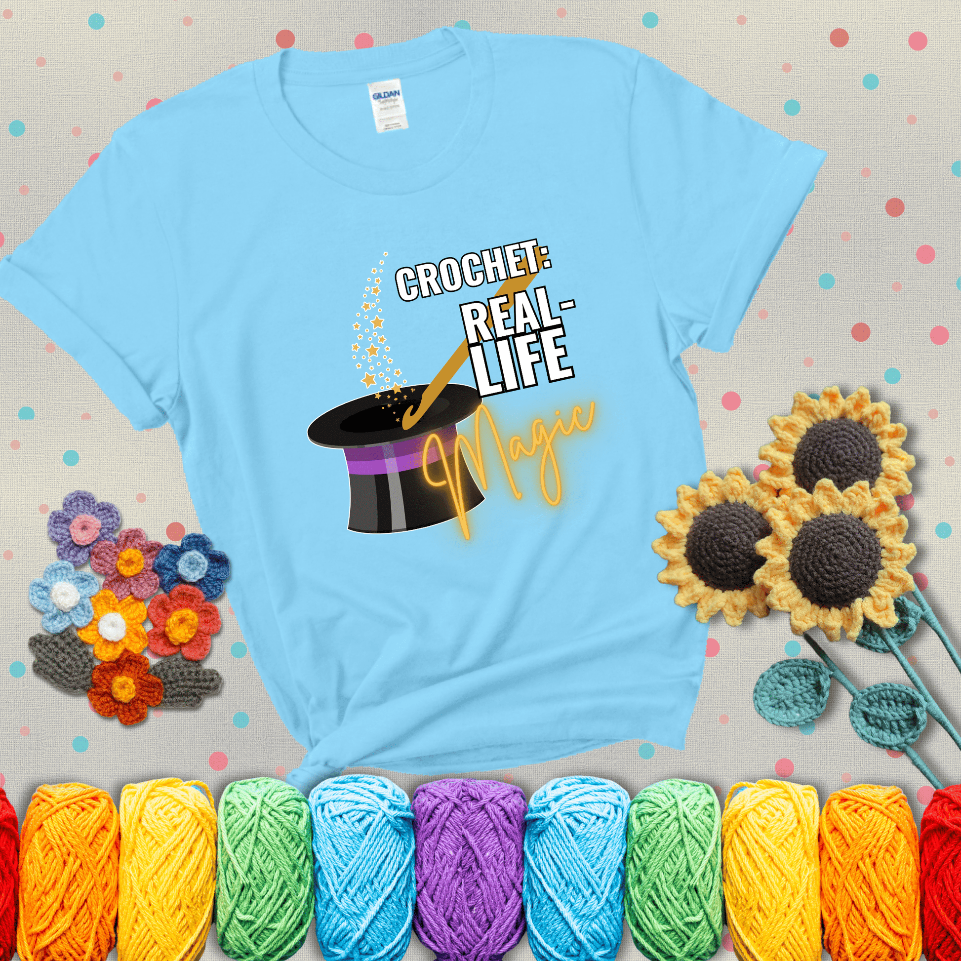 Poof! Stress gone Design reads 'Crochet: Real-Life Magic' , perfect crochet gift for yarn lovers; showing a light blue tee with grey sunflower background