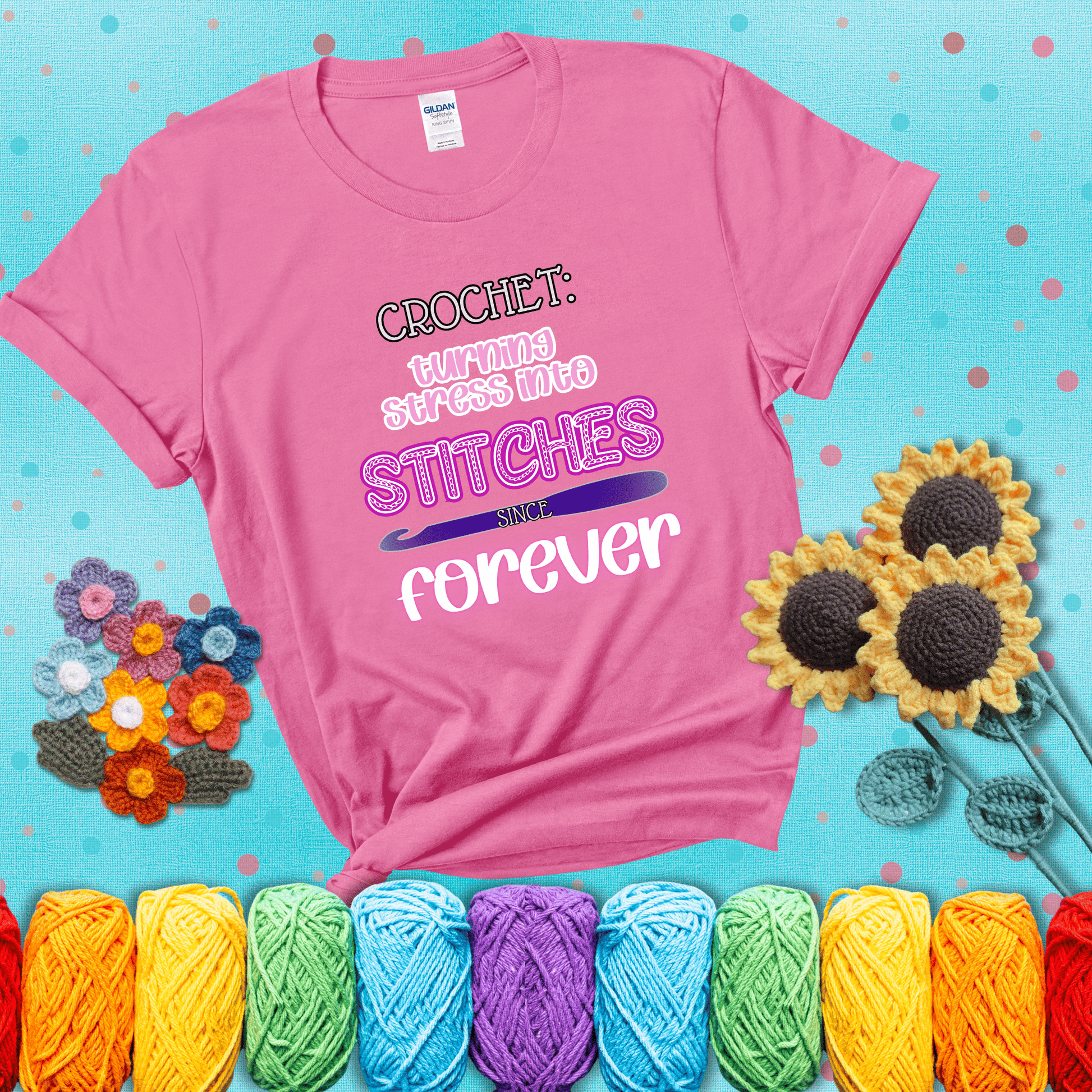 When life gets tangled, we stitch it out Design reads 'Crochet: Turning Stress Into Stitches Since Forever' , perfect crochet gift for yarn lovers; showing a pink tee with a teal sunflower background